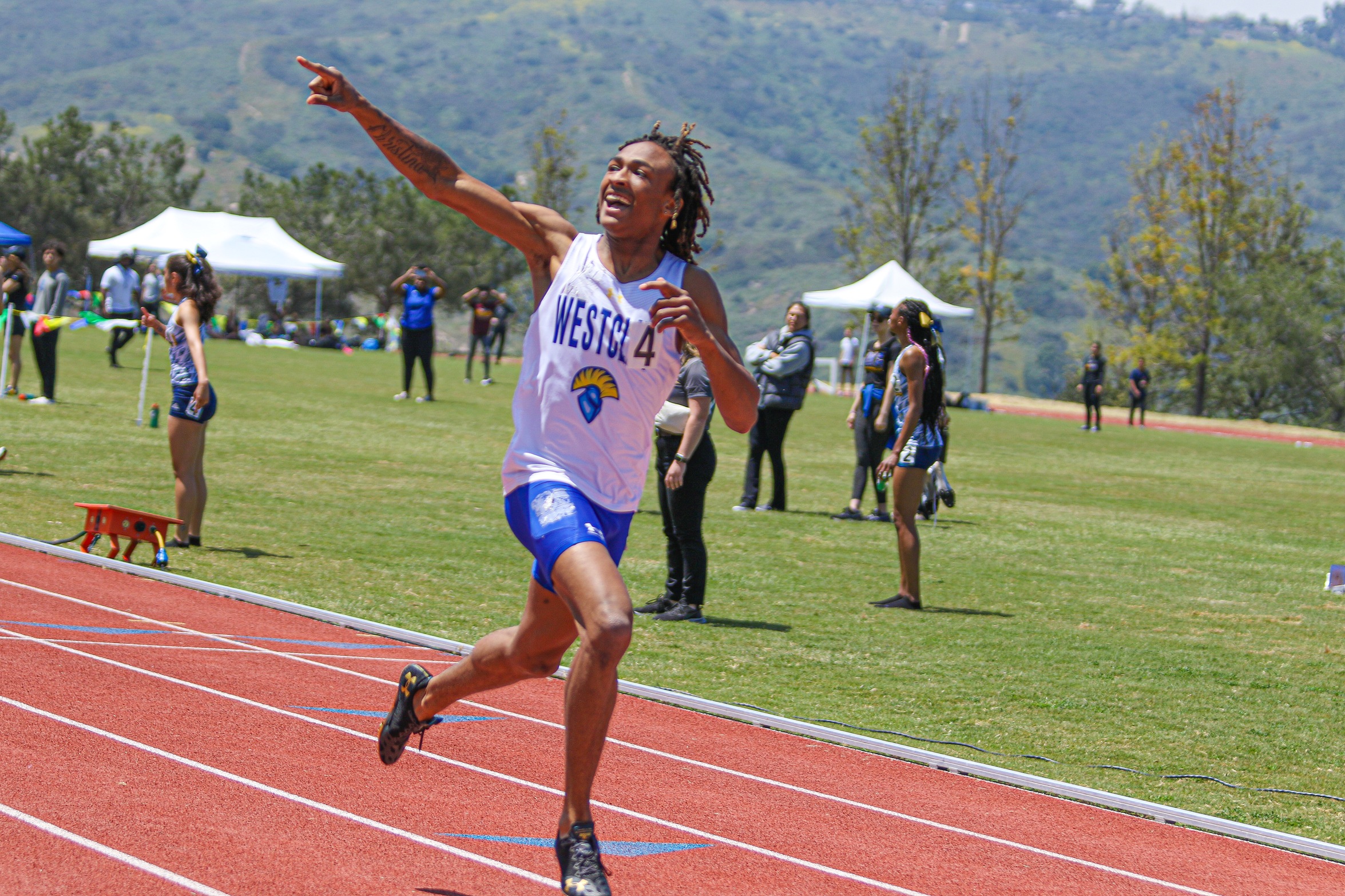 Harrison Horner wins the 400M in style. Photo by Adrian Wilson.