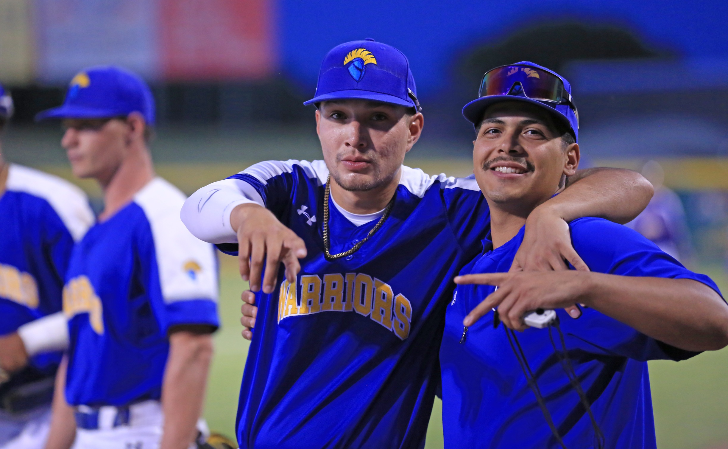 Ray Moore Jr. and Eddie Rios pose for a shot before the start of the Warriors 7-6 win over ERAU at the Cal Pac playoffs in Mesa, Arizona. Photo by Brandon Petersen.