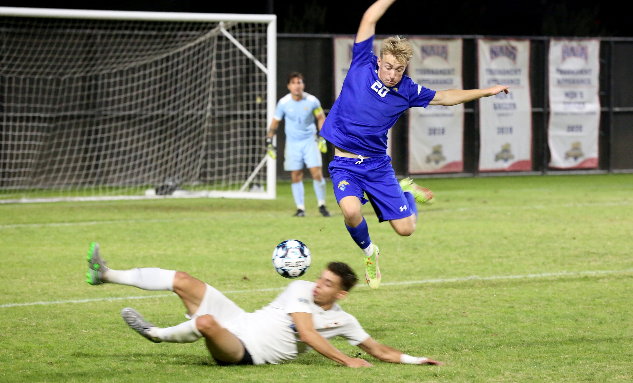 Mads Volden leaps over a would-be tackler in Westcliff's 2-0 loss to No. 2 Marymount Thursday night. Photo by Brandon Petersen.